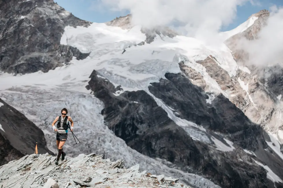 Skyrunner running on snowy mountain range