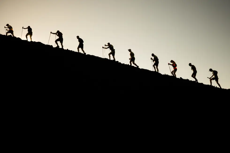 Silhouette of Athletes climbing a mountain at Transvulcania 2019