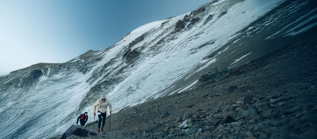 Skyrunners climbing mountain