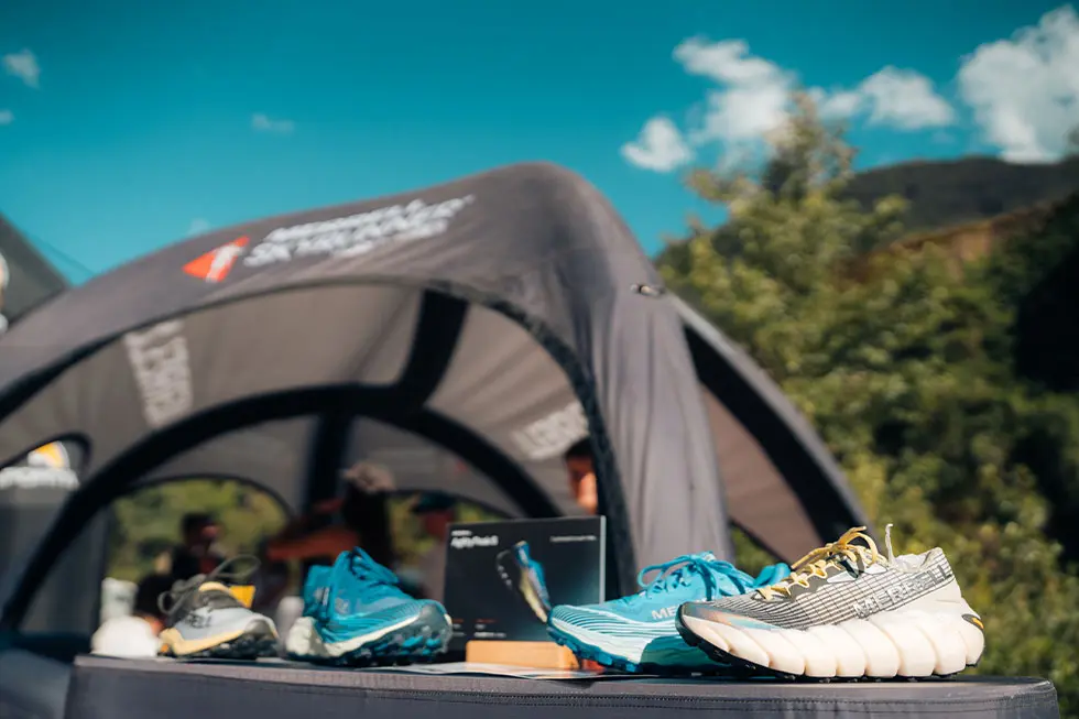 Skyrunning shoes, race vest and mountain safety equipment prepared for race day